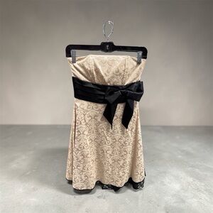 Speechless Champagne color Damask patter. Strapless Dress with Black Bow.